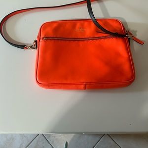 Kate spade orange crossbody bag with zipper front. Brand new condition